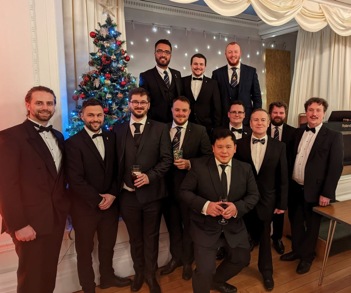 Members celebrating at a black-tie Christmas social