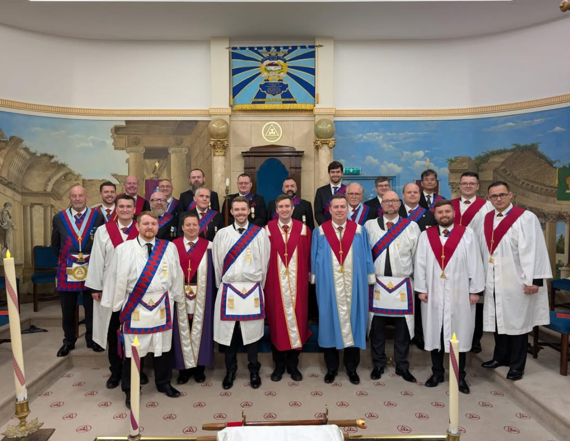 Officers and members in regalia in the Lodge room
