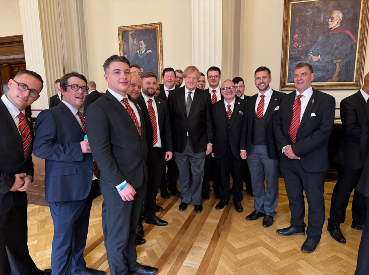 Members with a guest of honour at an event